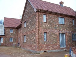 Quantock rubble stonework and brick quoining